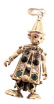 A gem set clown pendant, set with semi precious stones, in a yellow metal frame stamped 375, one sto