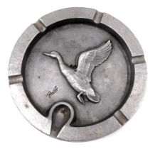 A large 20thC aluminium ashtray, cast centrally with a flying duck, indistinctly signed Bruce?, 24cm
