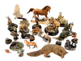 A quantity of animal ornaments, to include Sheraton and Simpson lion cubs, Country Artists osprey, L