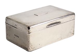 A George V silver cigarette box, with cedar lined interior, Birmingham 1928, 14cm wide.