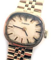 A 9ct gold Tissot wristwatch, with an oblong dial on cream face, with seventeen jewel movement, dial