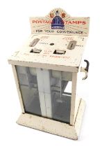 An American US Postage Service stamp dispenser, with stencilled decoration to top, cream paint, etc.