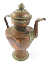 A Tibetan copper and silver coloured metal coffee pot, 39cm high. (AF)