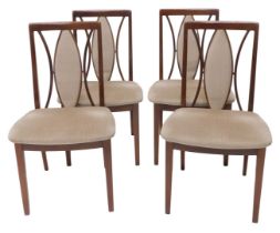 A set of four G-plan teak dining chairs, each with a padded seat on square tapering legs.