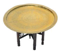 An Indian Benares engraved brass tray, on stand, 62cm diameter.