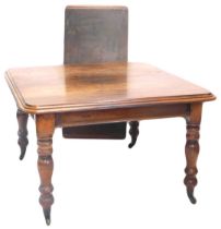 A Victorian mahogany extending dining table, the rectangular top with a moulded edge on turned legs,