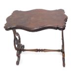 A late 19thC mahogany occasional table, the shaped top with a moulded edge on pierced end supports,