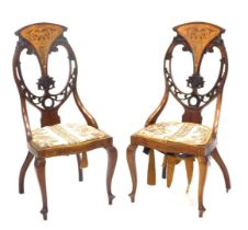 A pair of late 19th/early 20thC mahogany, satinwood and marquetry salon chairs, each with a pierced
