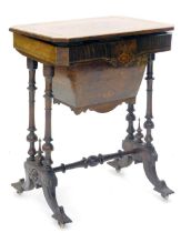 A Victorian walnut and marquetry work table, the canted rectangular hinged top enclosing a fitted in