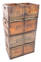 Four vintage beer crates, stamped Bullards Sons Limited Norwich.