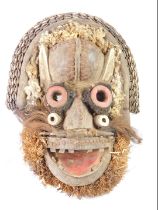 An African tribal Guere Chief's mask, embellished with horns, hare, Cote D'Ivoire circa 1950, 48cm h