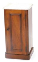 A Victorian mahogany pot cupboard, with a white marble top, above a panelled door, on a plinth, 74cm