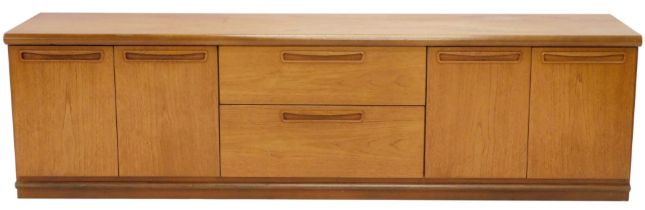 A teak low side cabinet, with an arrangement of two drawers and four doors, 54cm high, 201cm wide.