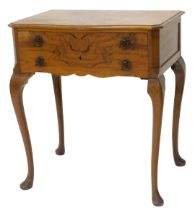 A figured walnut canteen, the serpentine fronted top with a moulded edge, above two drawers with rec