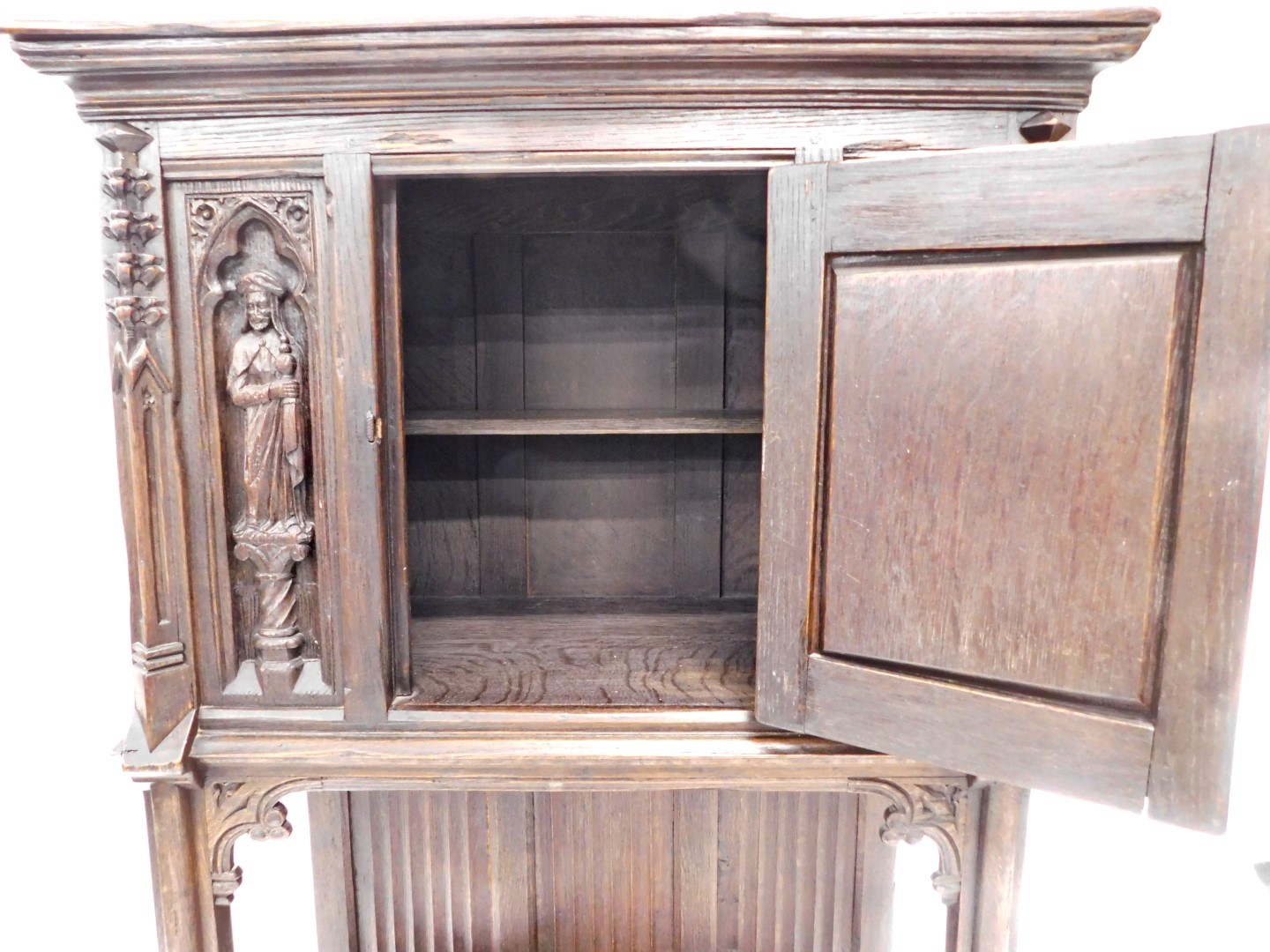 A 19thC oak carved Gothic cabinet, the rectangular top above a carved and frieze door, with two figu - Image 3 of 3