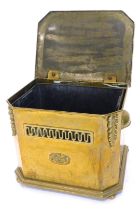 An Edwardian brass coal box, the canted rectangular lid enclosing a liner with a pierced frieze and