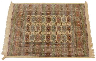 Woven mercerised cotton rug, with a design of medallions within elaborate geometric multicoloured bo