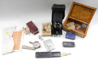 A Kodak Folding Brownie 5IX-20 camera, cut throat razor, playing cards, gemstones, etc. (1 tray)