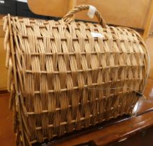 A wicker cat carry basket.