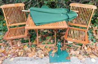 A table and chairs, parasol and base.