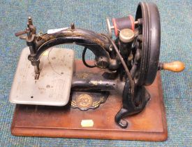 A Wilcox and Gibbs sewing machine.