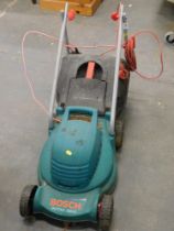 A Bosch Rotak 320C electric lawn mower.