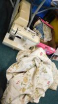 A selection of curtains and a new home sewing machine.