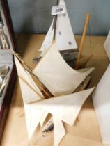 Three wooden pond yacht models.