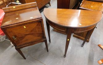 A mahogany reproduction demi-lune table and a 19thC mahogany bedside cupboard. (2)