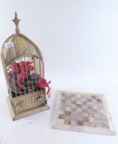 An onyx chess board, and cream metal bird cage ornament. (2)