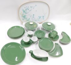 A green Poole pottery dinner service.