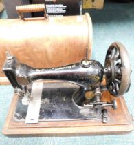 A cased Singer sewing machine.