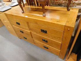 An oak sideboard, with arrangement of six short drawers.