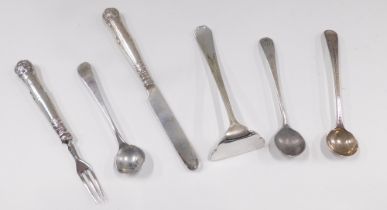 A group of silver and white metal cutlery, comprising a silver fiddle pattern tea spoon, three silve