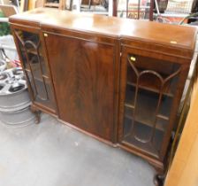 A mahogany bookcase with two astragal glazed doors and central cupboard.