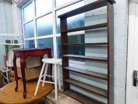 A painted pine milking stool, mahogany bookshelf, and a reproduction side table. (3)