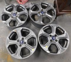 Four Ford alloy wheels.