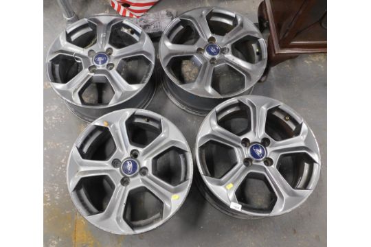 Four Ford alloy wheels.