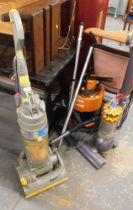 A Dyson DC4 vacuum cleaner, Dyson Ball DC50 vacuum cleaner, and a VAX wet/dry vac. (3)