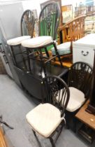 A mahogany drop leaf kitchen table and set of four wheelback chairs.