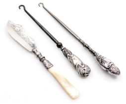 A Victorian silver butter knife, with mother of pearl handle, Birmingham 1862, and two silver handle