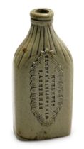 A mid 19thC stoneware wine and spirit bottle, with a fluted neck and shoulders, the body with a rais