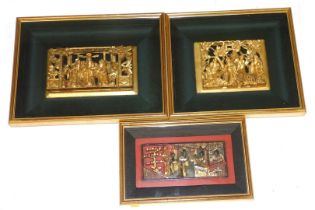 Three 19thC Chinese red and gilt lacquer furniture panels, each carved with figures, framed and glaz