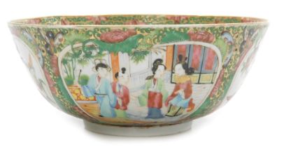A 19thC Cantonese famille rose porcelain bowl, decorated with reserves of figures in gardens, birds,
