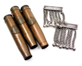 A pair of Spencer masonic apron chain tassels, and three shell cases, bearing applied arms of Guerns