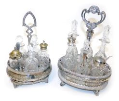 Two Victorian silver plated oval cruets, one containing six fitted jars and bottles, the other with