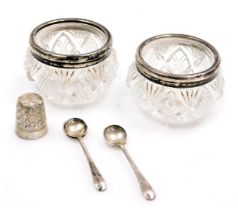 A pair of George V cut glass salts, with silver rims, Birmingham 1927, a pair of George V silver sal