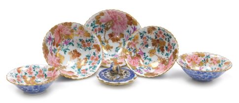 A set of five Japanese porcelain graduated bowls, decorated internally with peonies and butterflies,