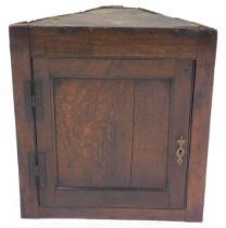 A 19thC oak wall hanging corner cupboard, 70cm high, 63cm wide, 26cm deep.