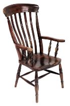 A Victorian oak and elm lath back kitchen chair, with a solid saddle seat,